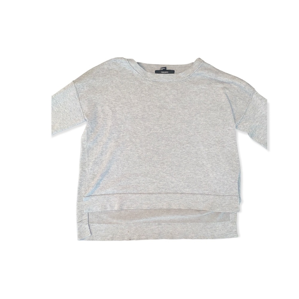Grey sweatshirt oversized tee over the pants above in the front